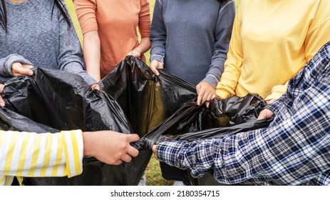 Asia Woman Group Team Volunteer Picking Up Trash Plastics Garbage Plastic Waste. Friend Putting Plastic Garbage Waste Into Bag At Park Concept Team Volunteer Charity Reduce Global Warming Save Earth