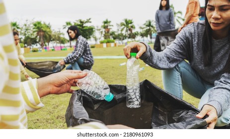 Asia Woman Group Team Volunteer Picking Up Trash Plastics Garbage Plastic Waste. Friend Putting Plastic Garbage Waste Into Bag At Park Concept Team Volunteer Charity Reduce Global Warming Save Earth