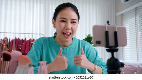 Asia woman micro influencer record live viral video camera at home studio. Happy youtuber fun talk speak advice review hobby in media. Vlogger selfie shoot enjoy work show smile teach like share app.