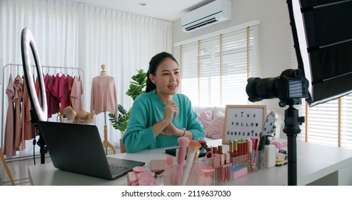 Asia woman micro influencer record live viral video camera at home studio. Happy youtuber fun talk speak advice review hobby in media. Vlogger selfie shoot enjoy work show smile teach like and share. - Shutterstock ID 2119637030