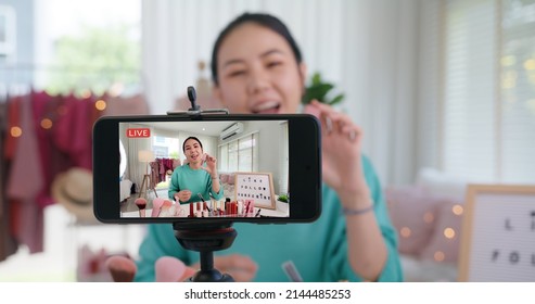 Asia woman micro influencer record live viral video camera at home studio. Happy youtuber fun talk speak advice review hobby in media. Vlogger selfie shoot enjoy work show smile teach like share app.