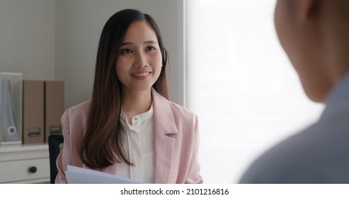 Asia Woman Real Estate Sale Agent Or Trader Advice Sitting At Lawyer Office Desk  Smile Trust Talk In Wealth Service Legal Tax Consult. HR People Brief Or Coach For Happy Work Plan In Bank Loan Job. 