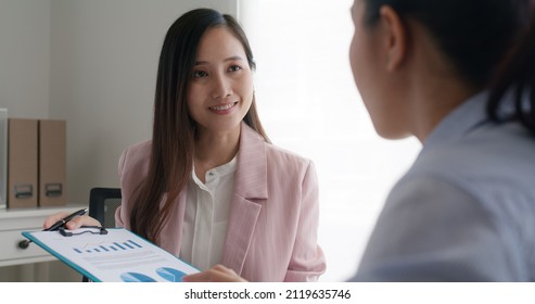 Asia Woman Real Estate Sale Agent Or Trader Advice Sitting At Lawyer Office Desk  Smile Trust Talk In Wealth Service Legal Tax Consult. HR People Brief Or Coach For Happy Work Plan In Bank Loan Job. 