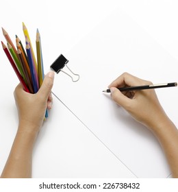 Asia Woman Right Hand With Black Pencil And Left Hand With Colorful Pencil On Blank White Paper Over White Background