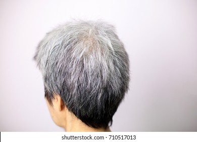 Asia Woman Shows Her Gray Hair Roots