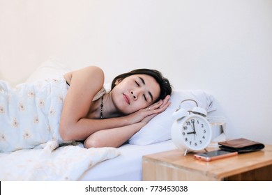 Asia woman sleepy at 9.00 p.m. for good health.

 - Shutterstock ID 773453038
