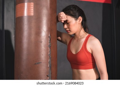 Asia Woman Sweat And Tired With Boxing Sandbag