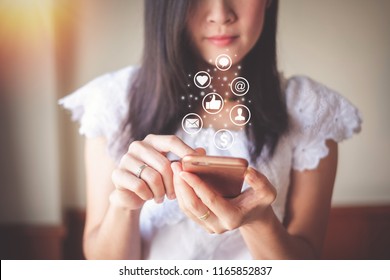 Asia Woman Using Mobile Phone For Checking Social Media And Success Of Business.