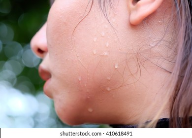 Asia womans face is covered in sweat. (Selective focus)