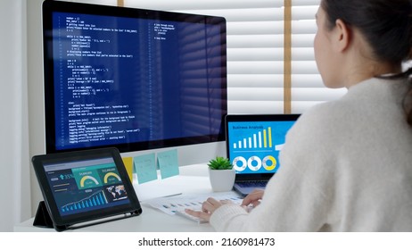 Asia Young Business Woman Sit Busy At Home Office Desk Work Code On Desktop Reskill Upskill For Job Career Remote Self Test IT Deep Tech Ai Design Skill Online Html Text For Cyber Security Workforce.