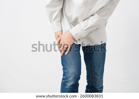 Asian 20s man with sciatica in white background, no face