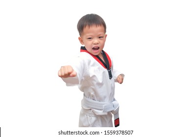 Asian 3 - 4 Years Old Toddler Boy Child Posing In Fighting Action Isolated On White With Clipping Path, Taekwondo Class For Toddler, Fun & Fitness Martial Arts For Kids Concept, Soft & Selective Focus