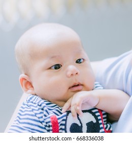 Asian 3 Month Baby Looking Up At Mother.Mother And Baby.Love Tender And Care Concept.