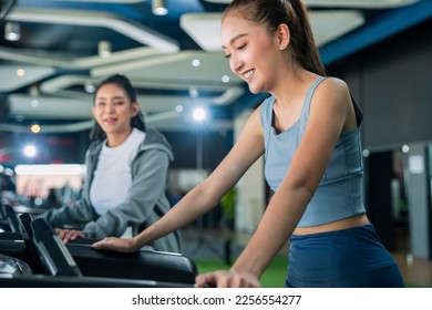 asian adult female sport woman jogger running on treadmill athletic working out active healthy lifestyle with cheerful freshness sweaty cardio exercise at fitness gym sport club morning wellness day - Shutterstock ID 2256554277