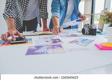 Asian advertising designer creative start-up team discussing ideas in office. - Shutterstock ID 1265645623