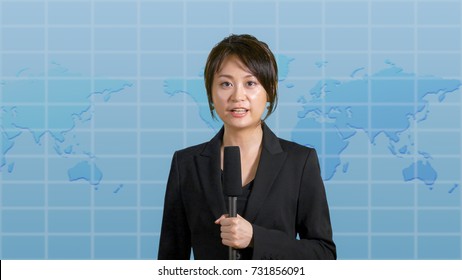 Asian American Female News Anchor In Studio With Map Background, TV News Concept