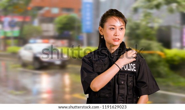 Asian American Woman Police Officer at Crime scene
Talking on CB Radio