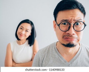 Asian Angry And Annoyed Husband With Happy And Stubborn Wife Argument Concept.