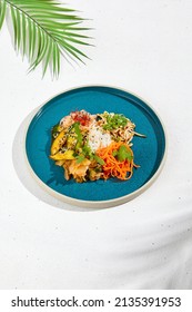 Asian Appetizers: Spicy Carrot, Pickled Cucumber, Soy Bean And Rice. Assorted Asian Appetizers In Ceramic Dish On White Background. Asian Food In Summer Menu