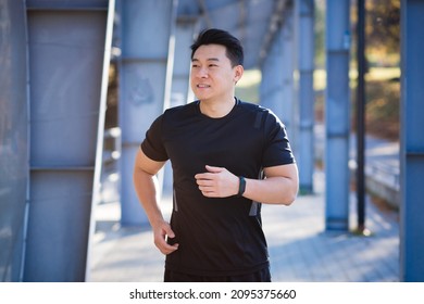 Asian Athlete On A Morning Jog Near The Stadium, Successful Male Businessman Is Engaged In Fitness In The Morning Before Work