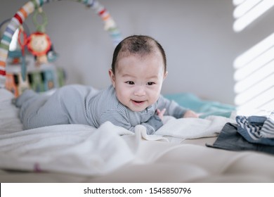 Asian Baby Boy Doing Tummy Time At Home