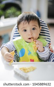 Asian Baby Boy Eat With Finger Food, Soft Focus