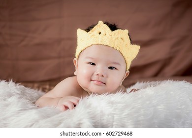 Asian Baby Boy Lying On Bed