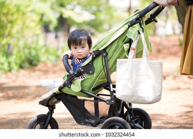 Asian Baby Boy Taking A Walk With Mom