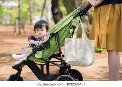 Asian Baby Boy Taking A Walk With Mom