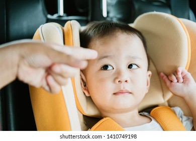 Asian Baby Boy While Mother Scolding On Car Seat In The Car When He Go To School In The Morning.Little Asian Toddler Boy Make Boring Face. 