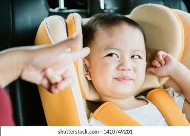 Asian Baby Boy While Mother Scolding On Car Seat In The Car When He Go To School In The Morning.Little Asian Toddler Boy Make Boring Face. 