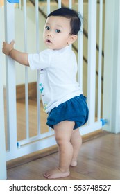 Asian Baby Cute Boy In The Safety Door