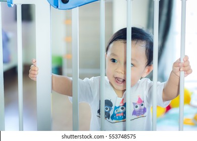 Asian Baby Cute Boy In The Safety Door