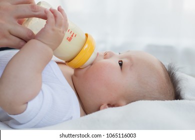 asian baby drinking milk