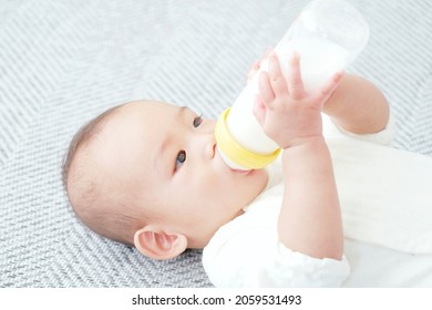 Asian baby drinking a milk