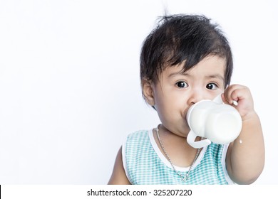 Asian Baby Drinking Milk From Baby Bottle On White Background