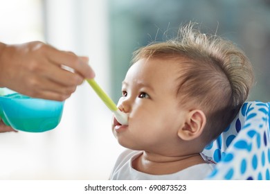 Asian Baby Girl Already 6 Months Old Starts Eating Food And Feeding By Mom.