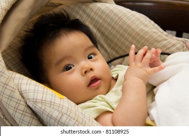 Asian Baby Girl In A Car Seat