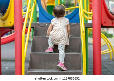 Asian Baby Girl Are Climbing The Stairs.