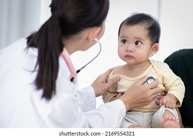 An Asian baby girl comes to see a female doctor for a check-up. - Powered by Shutterstock