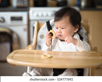 Asian Baby Girl Eating Finger Food First Time