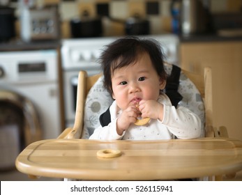 Asian Baby Girl Eating Finger Food First Time