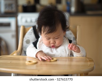 Asian Baby Girl Eating Finger Food First Time