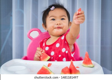 Asian Baby Girl Eating Watermelon.