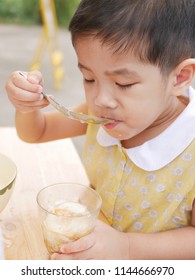 Asian Baby Girl Enjoy Trying New Food By Herself, Soft-boiled Egg (Kai Luak) - Helping The Baby Get Familiar With A Challenge Or Trying New Things In Life