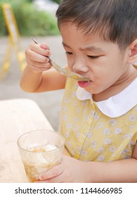 Asian Baby Girl Enjoy Trying New Food By Herself, Soft-boiled Egg (Kai Luak) - Helping The Baby Get Familiar With A Challenge Or Trying New Things In Life