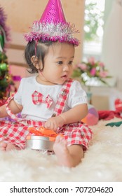 Asian Baby Girl  Nine Months Sitting & Wearing Party Hat,New Year & X'?mas Celebrate Concept.