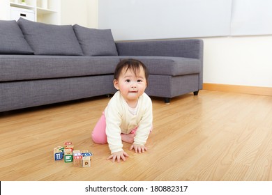 Asian Baby Girl Play Wooden Toy Block