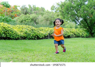 Asian Baby Girl Smile And Running In The Garden