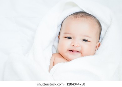 Asian Baby Girl Under White Towel After Done Shower